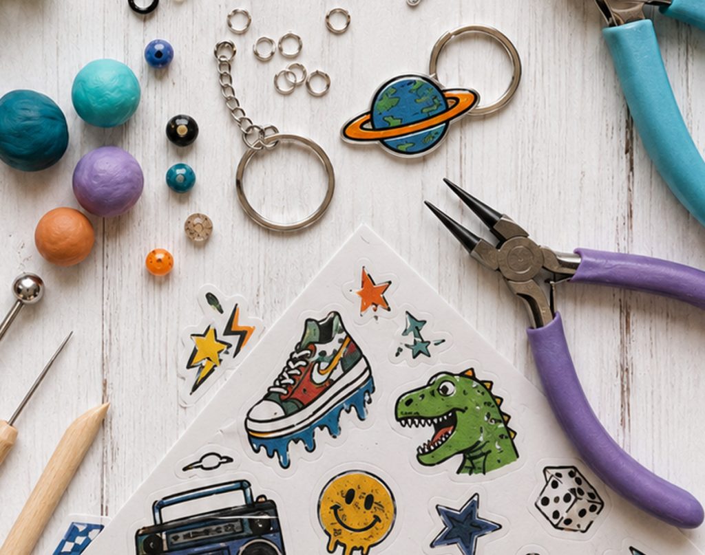 Home Page - workshops Craft workshop table with clay beads, keyrings, stickers and pliers laid out