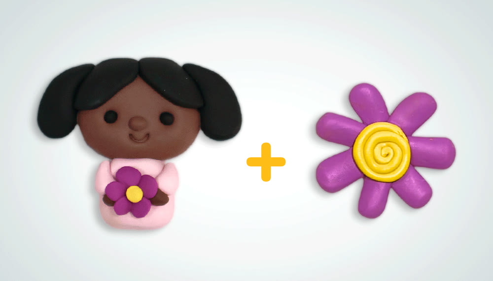A clay mini portrait of a girl, plus one clay flower